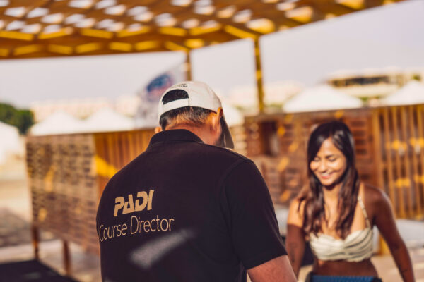 PADI course director helping a student