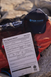 Dive Against Debris Data Card, PADI AWARE hat and AWARE debris collection bag