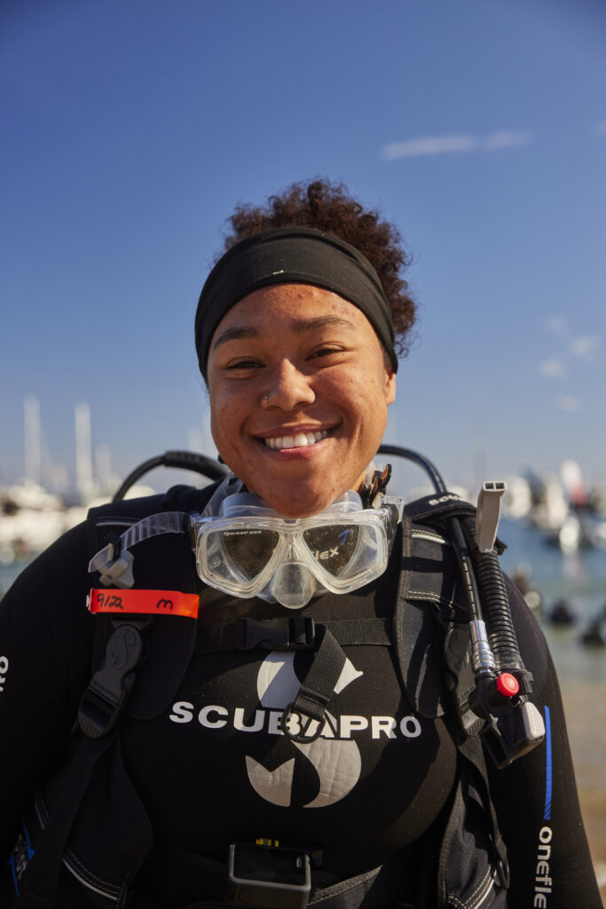 Young woman wearing diving equipment