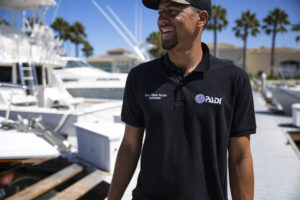 Man Smiling Next to boat