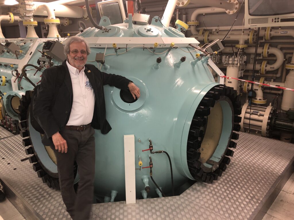 Alessandro Marroni with a decompression chamber
