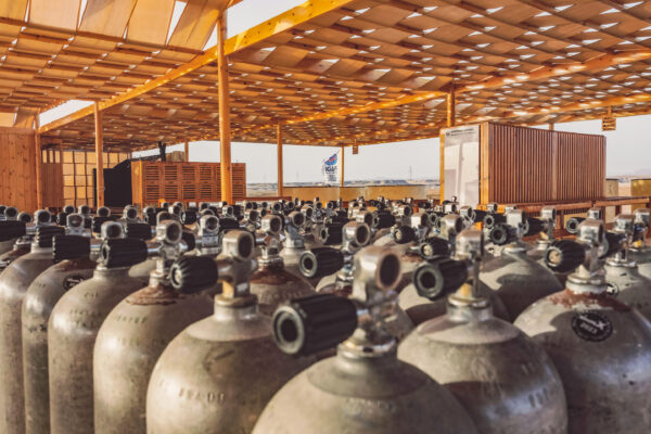 dozens of scuba tanks photographed together at a dive shop in Egypt