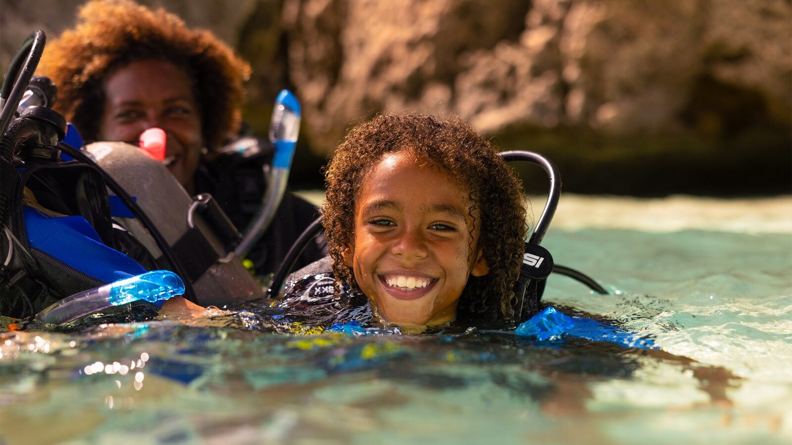 a young divers at the surface of the water