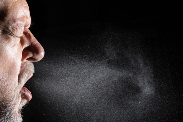 Person sneezing, airborne pathogens
