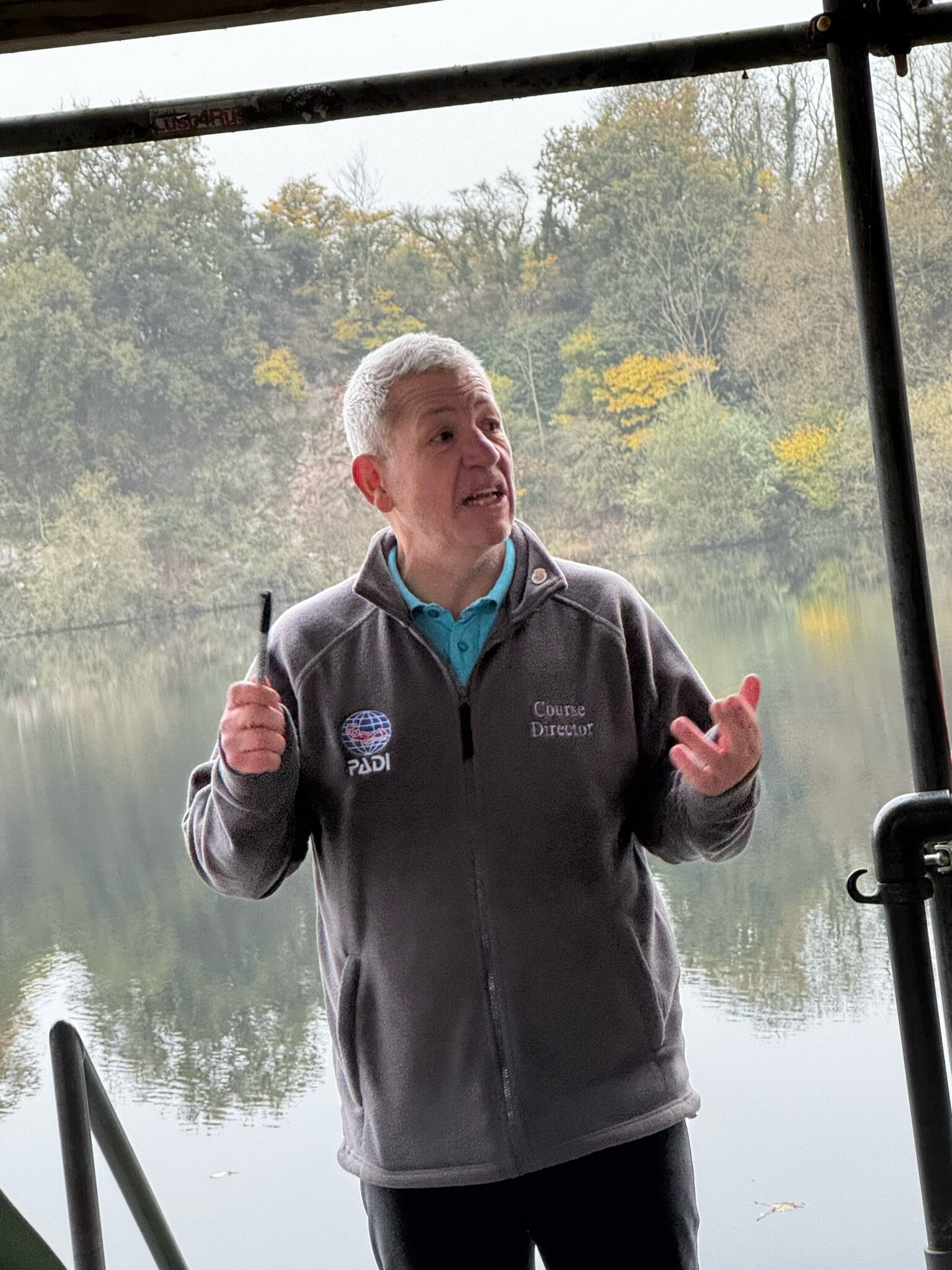 Man in a gray PADI fleece giving a presentation- winner of MSD Challenge 2025