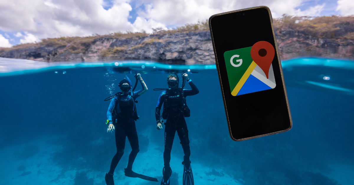 Divers descent into the water but there is a phone overlaid on top of the image showing a Google icon